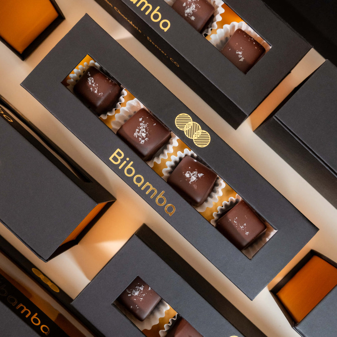 A box of 4 Bibamba chocolate salted caramels, available in milk chocolate or dark chocolate