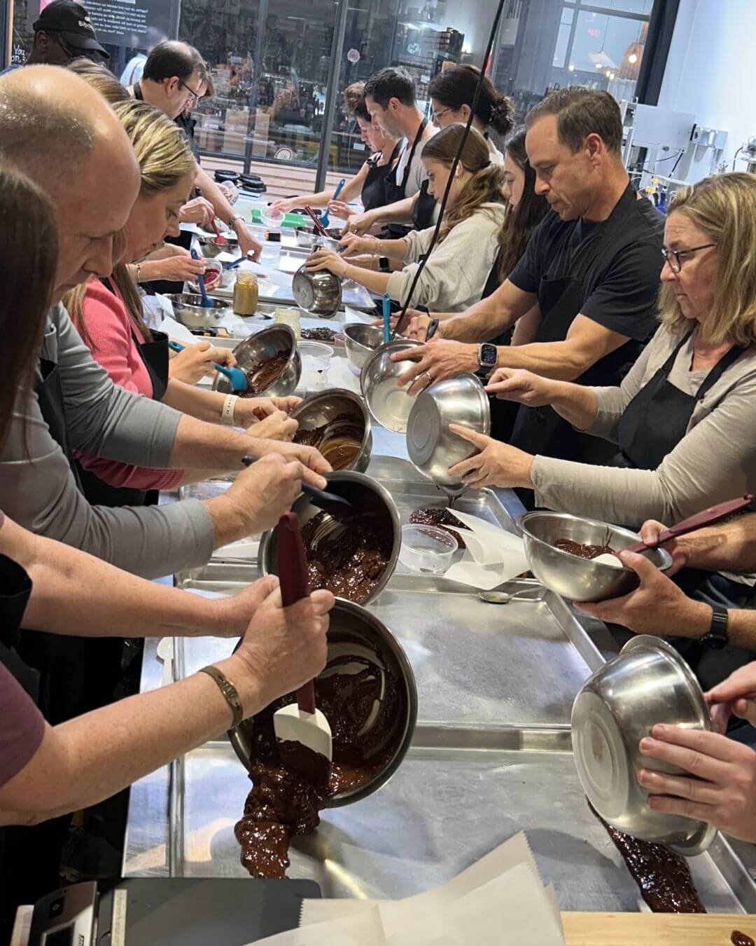 A group making chocolate at Bibamba's bean-to-bar chocolate making experience
