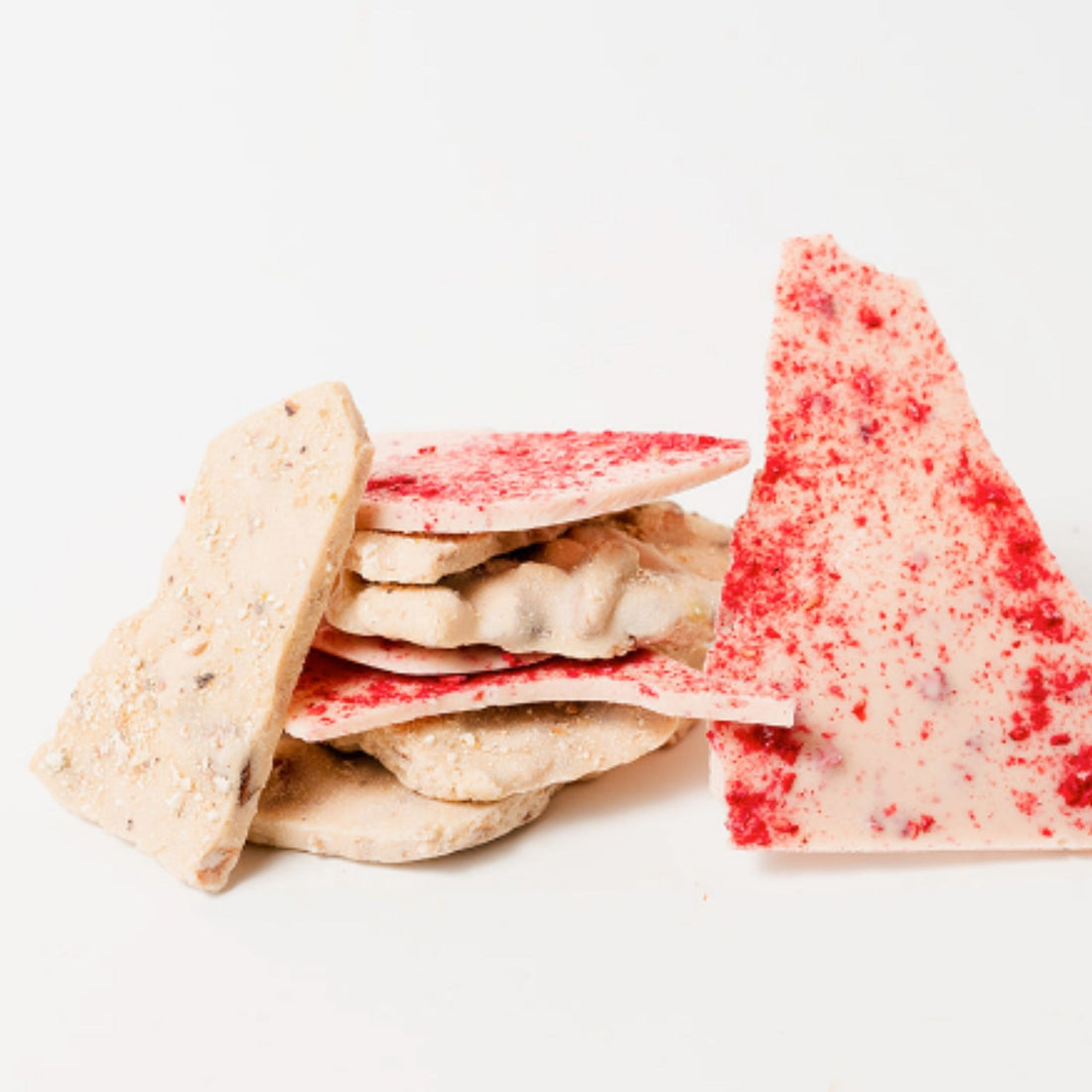 Stacks of white chocolate with almond and white chocolate with raspberry